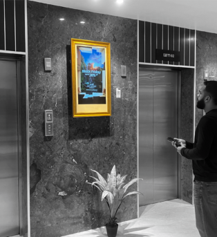 Adonmo screen in a residential lift lobby